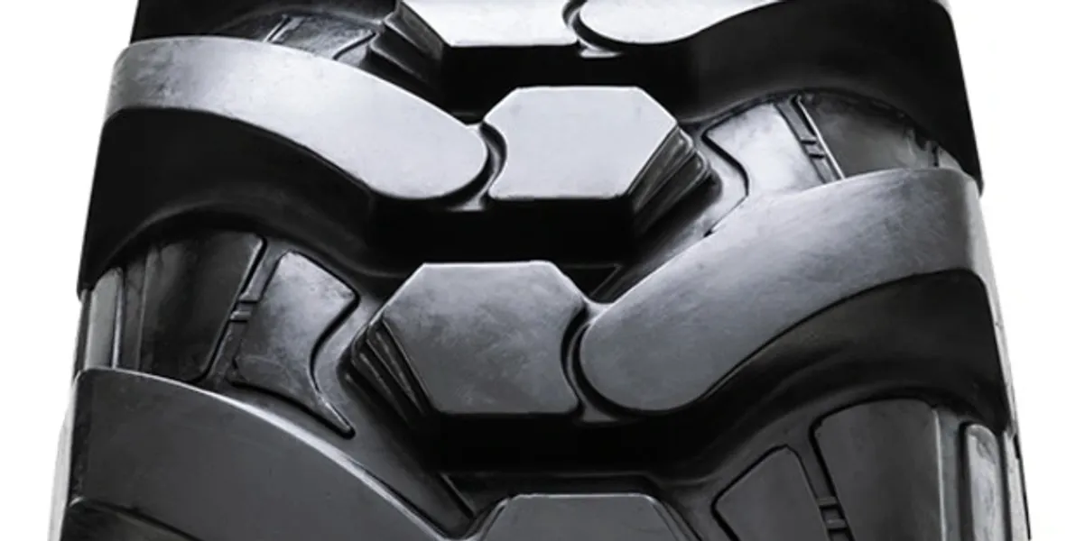rs=w_1200,h_600,cg_true,m A close up of the tire tread on an industrial vehicle.