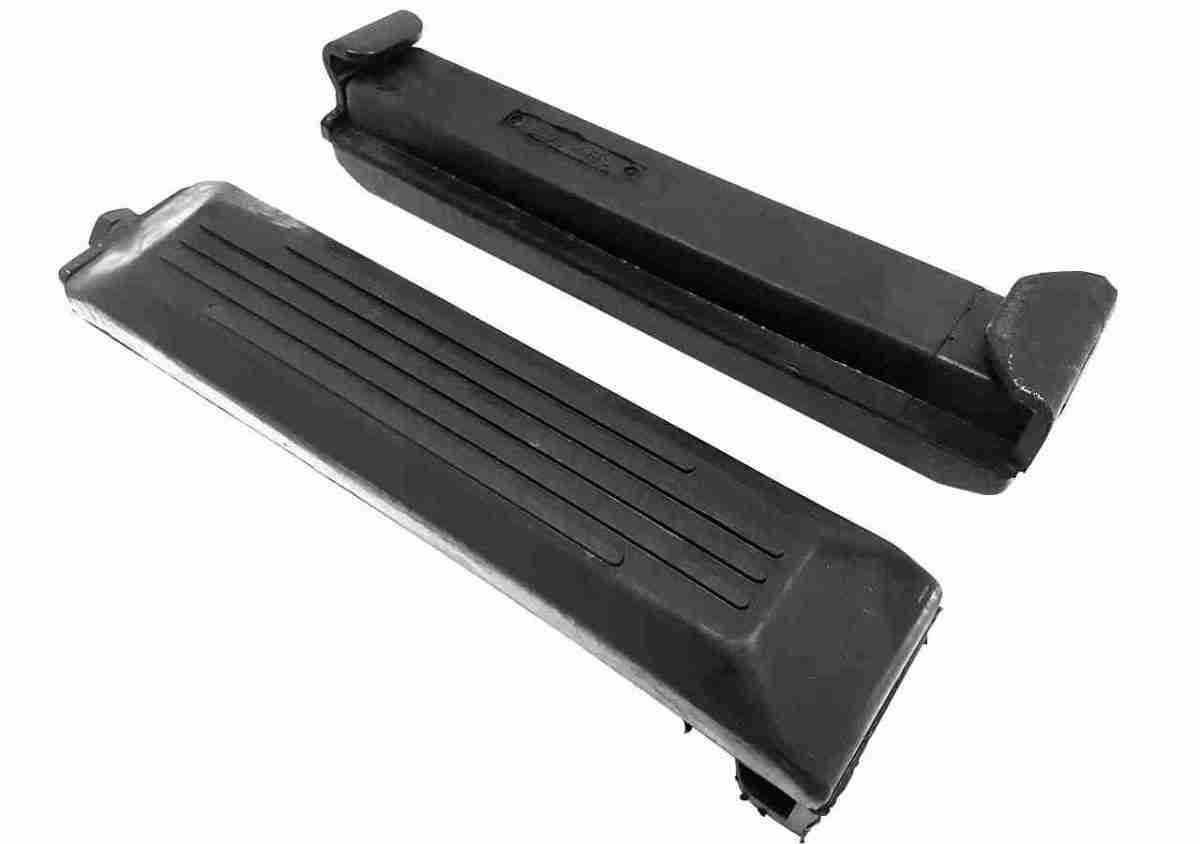 A pair of black plastic steps with metal ends.