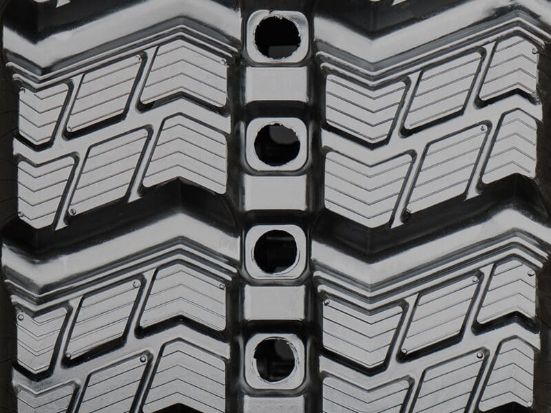 A close up of the tire tread pattern on a car.